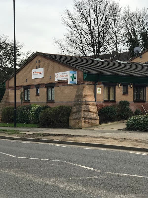 Woodhouse Health Centre building with signage, greenery, and a road in front, located in Woodhouse, Yorkshire.