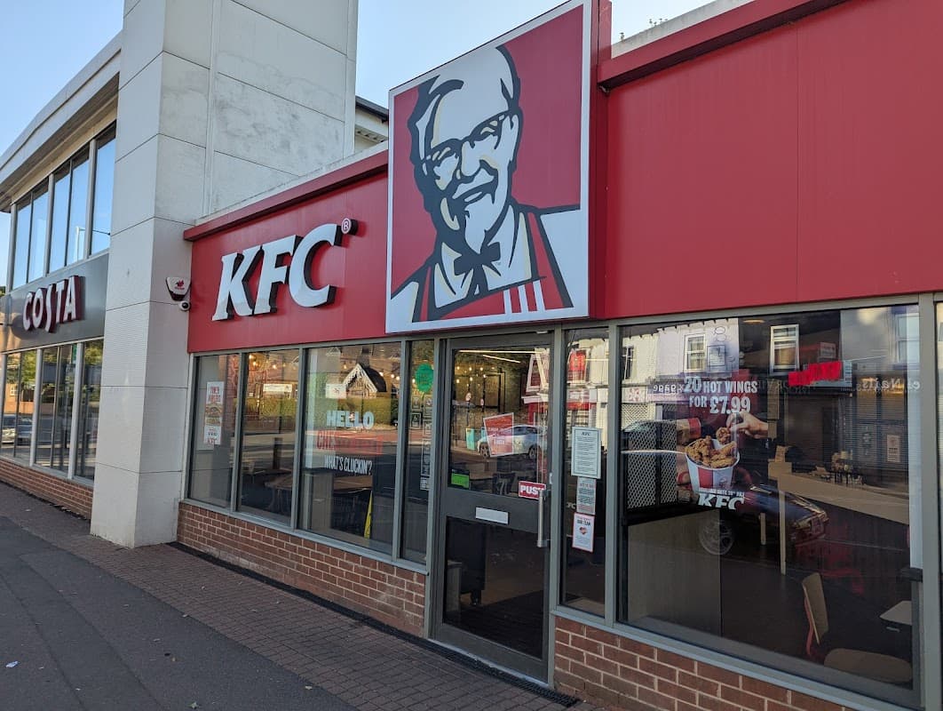KFC restaurant exterior featuring a Colonel Sanders logo and EV charging station in Woodseats, Yorkshire.