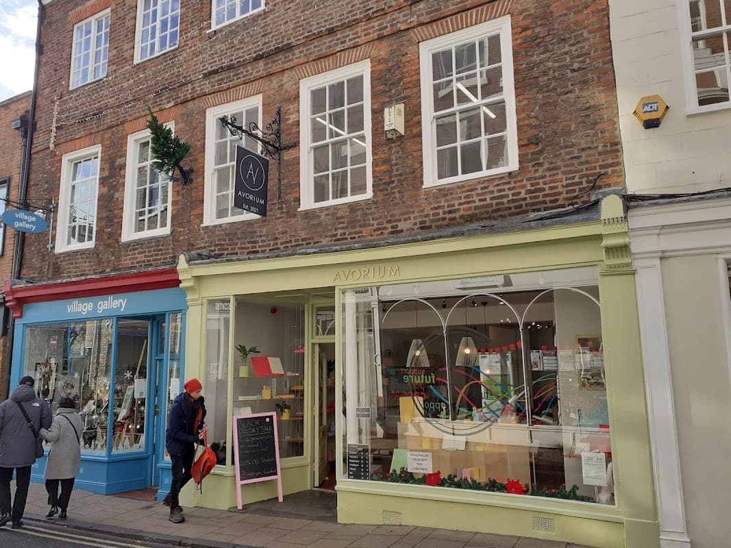 Avorium stationery shop with large windows, colorful displays, and a brick facade in York, Yorkshire.