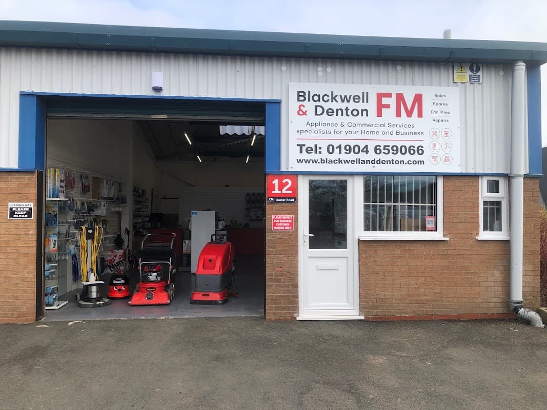 Storefront of Blackwell & Denton FM Ltd, showcasing cleaning equipment and appliances, with a clear sign and contact info.