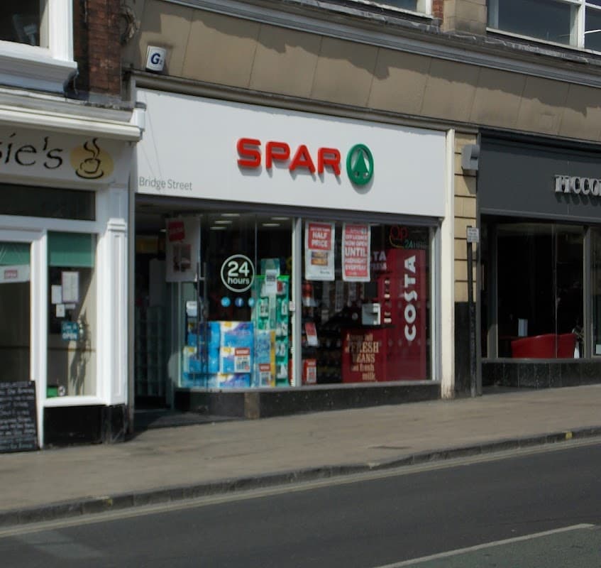 Spar store on Bridge Street, featuring a 24-hour sign and Costa coffee branding in the window.