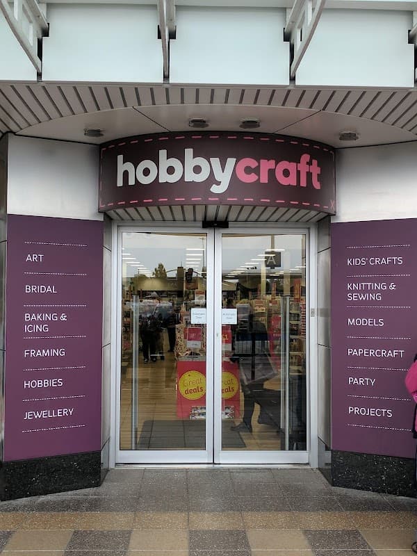 Entrance of Hobbycraft in York with signage highlighting various craft categories like art, baking, and knitting.