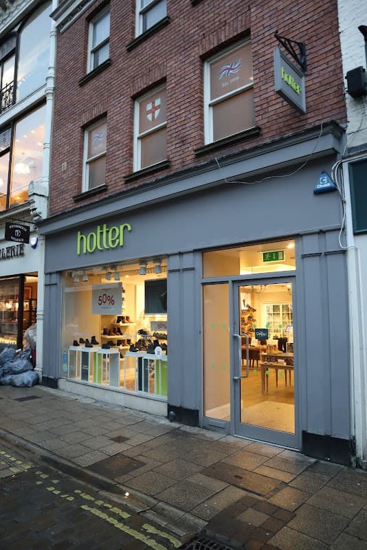 Hotter Shoes store exterior in York, featuring a large window display and a bold green sign above the entrance.