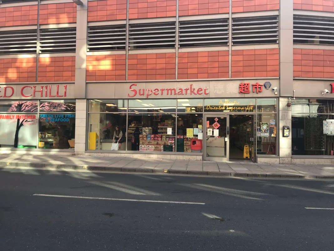 Red Chilli Supermarket storefront with large windows, bright signage, and displays of groceries in York, Yorkshire.