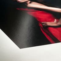 Hahnemühle FineArt Baryta Satin paper with glossy finish, featuring a vivid red dress print on a smooth white sheet.