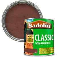 Green can of Sadolin Classic Wood Protection with brown wood stain and label showing wood texture.