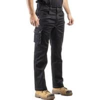 Black Caterpillar Operator Fx trousers, size 42, with multiple pockets and reinforced knees, worn with tan work boots.