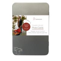 Hahnemühle A6 White Pearl photo paper in a sleek silver tin with a label showing a scenic photo and product details.