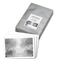 Hahnemühle Platinum Rag Art paper pack with 25 sheets, featuring a silver wrapper and sample print images.