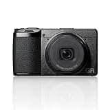 Black Ricoh GR IV compact digital camera, 28mm lens, textured grip, sleek design, and prominent GR branding.