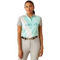 Ariat Women's Taryn Polo in Beach Glass color, featuring a diagonal white stripe and gray sleeves.