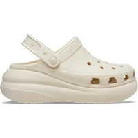 Beige Crocs Classic Crush Clog with elevated sole, ventilation holes, and adjustable heel strap.