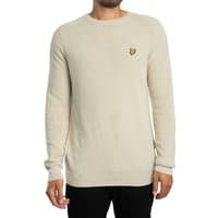 Cream rib knit sweater by Lyle & Scott with crew neck and embroidered logo on chest.