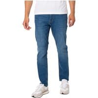 Blue slim-fit jeans with subtle fading, mid-rise waist, and classic five-pocket design worn with white sneakers.