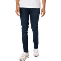 Dark blue slim-fit jeans by Jack & Jones, featuring a classic five-pocket design and subtle fading on the thighs.