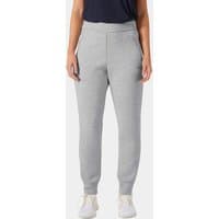 Grey Helly Hansen HP Ocean Trousers, XL, with elastic waistband and tapered legs, worn by a model with white sneakers.