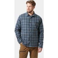 Navy blue plaid insulated shacket with button closure, chest pocket, and collar, worn by a male model.