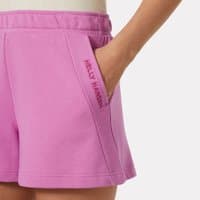 Pink Helly Hansen women’s sweat shorts, medium size, with side pockets and embroidered logo on the left pocket.