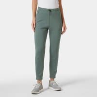 Green Helly Hansen women’s tracksuit bottoms, elastic waistband, drawstring, tapered legs, side pockets, size L.