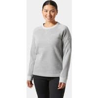 Gray Helly Hansen women's crewneck sweater, medium size, with ribbed cuffs and hem, worn by a smiling woman.
