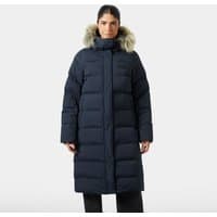 Navy Helly Hansen women's long parka with faux fur hood trim, quilted design, and front zipper closure.