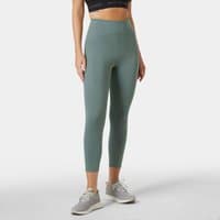 Green Helly Hansen women's leggings, high-waisted, ankle-length, size XL, worn by model with sneakers.