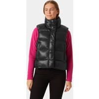 Black Helly Hansen women's puffer vest, high collar, sleeveless, XS size, worn over pink long-sleeve shirt.