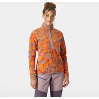Orange printed fleece with floral pattern, quarter zip, and high collar, worn by a model.