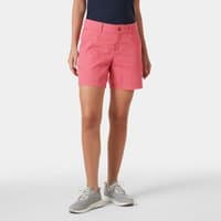 Red Helly Hansen women's shorts with front button, belt loops, and side pockets, worn with a navy top and gray sneakers.