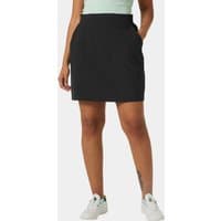 Black Helly Hansen Thalia Skirt 2.0, knee-length, XS, with side pockets, worn by a model with white sneakers.