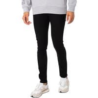 Black skinny jeans by jack & jones, featuring a snug fit, paired with white sneakers and a gray sweatshirt.