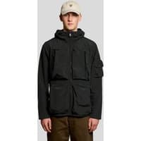 Black Lyle & Scott men's windbreaker jacket with hood, front zip, and multiple pockets, worn by model in beige cap.