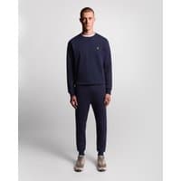 Navy skinny fit cotton joggers by Lyle & Scott, featuring an elastic waistband and cuffed ankles.