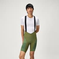 Olive green men's bib shorts with black straps, featuring a sleek design and subtle panel detailing.