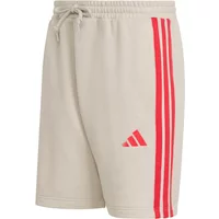 Beige Adidas shorts with red 3-stripes on the side, elastic waistband, and drawstring.