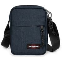 Denim Eastpak crossbody bag with front pocket, black adjustable strap, and zipper closure.