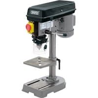 Gray Draper bench drill press with black motor housing, safety shield, and adjustable metal work table.