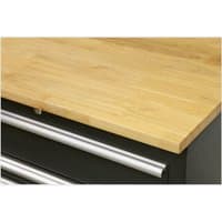 Oak worktop with smooth finish, light wood grain, mounted on a black cabinet with silver drawer handles.
