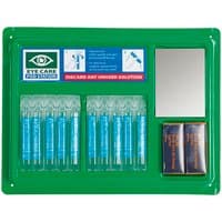 Green Sealey Eye/Wound Wash Station with mirror, saline pods, and bandage packs neatly arranged on a wall-mounted panel.