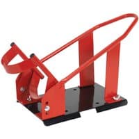 Red and black Sealey motorcycle front wheel chock with sturdy metal frame and adjustable cradle.