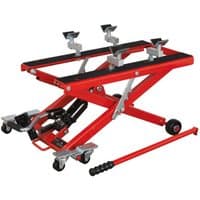 Red Sealey scissor lift for motorcycles and quads, 500kg capacity, with hydraulic mechanism and caster wheels.