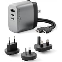 Gray ALOGIC 67W GaN charger with dual USB-C ports, USB-A port, and interchangeable plug adapters for global use.