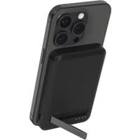 Black Belkin BoostCharge Pro wireless charger with stand, supporting a smartphone in an upright position.