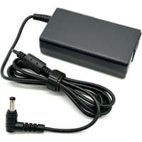 Black BTI 65W laptop charger with rectangular power brick and coiled cable ending in a right-angle connector.