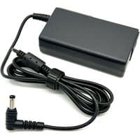 Black BTI 65W charger with rectangular body, 5.5mm x 2.5mm tip, and coiled UK power cable.