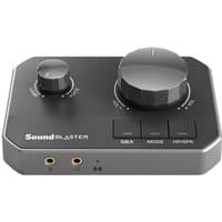 Black and gray Creative Labs Sound Blaster G8 USB audio interface with large volume knob, buttons, and headphone jacks.