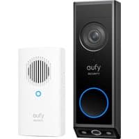 Black Eufy E340 2K video doorbell with dual cameras and blue LED ring, paired with white chime featuring speaker grille.