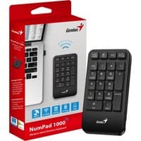 Black Genius NumPad 1000 wireless numeric keypad with 2.4GHz connectivity, shown with packaging beside a laptop.