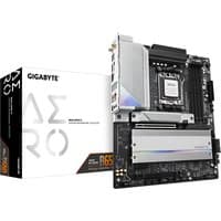 GIGABYTE B650 AERO G motherboard with silver heatsinks, black PCB, and white accents, next to branded box.