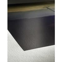 Hahnemühle A4 satin-matt photo paper, smooth texture, subtle sheen, corner detail on wooden surface.